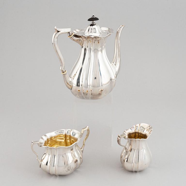 A swedish parcel-gilt coffee pot, creamer and suga bowl.