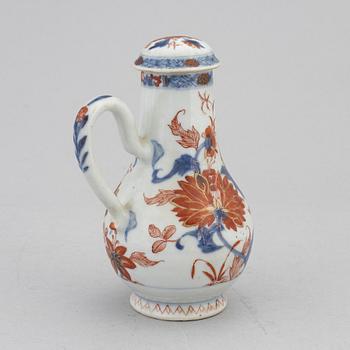 A Chinese porcelain ewer with cover, a pair of cups with saucer, Kangxi,