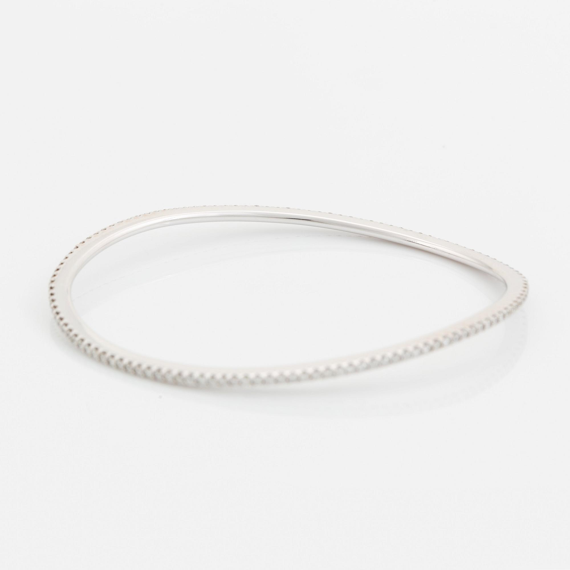 An Ole Lynggaard 18K white gold "Love" bangle set with round brilliant-cut diamonds, design Charlotte Lynggaard.