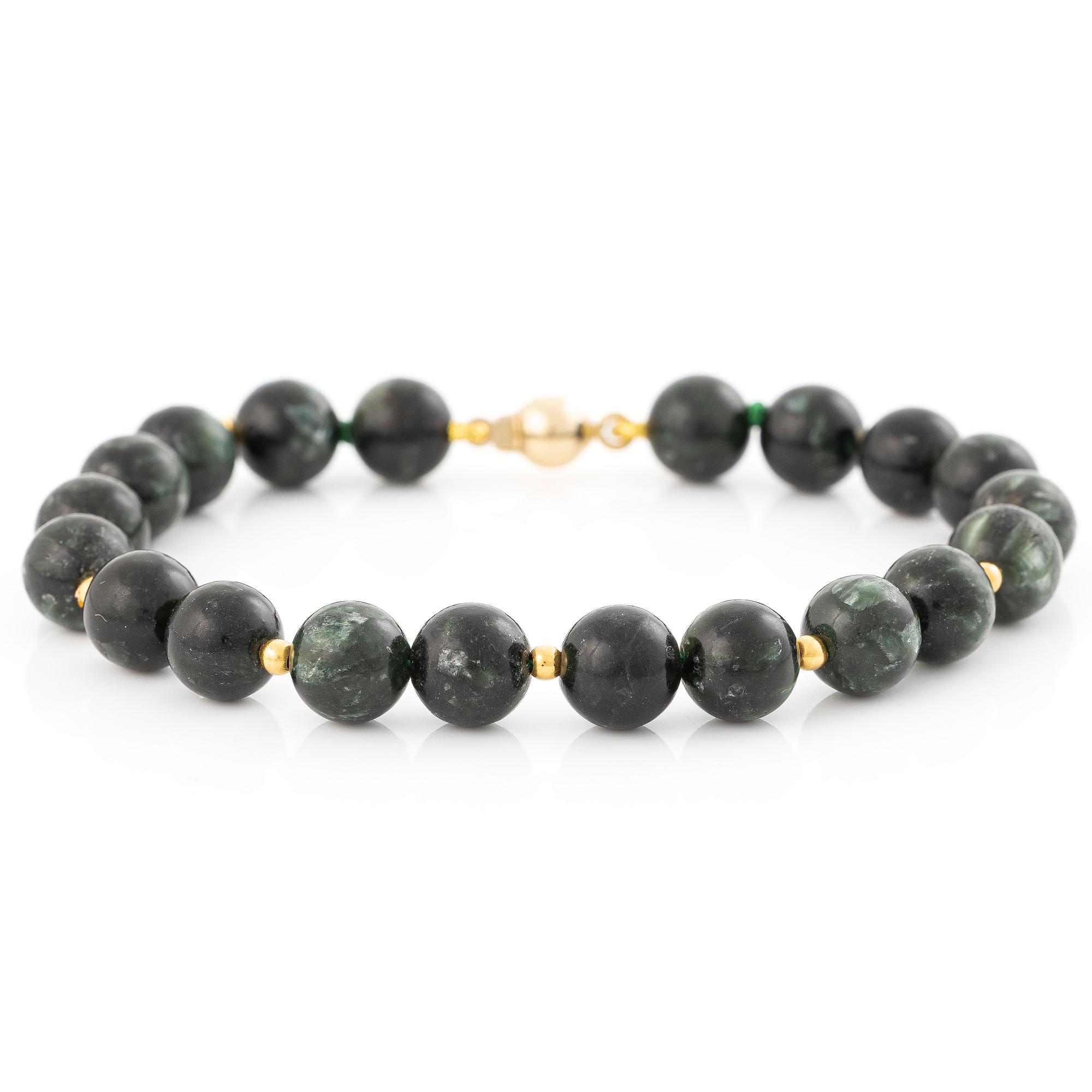 Bracelet, with dark green stones, clasp in 18K gold.