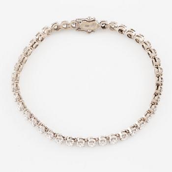 Tennis bracelet, 18K white gold with round brilliant-cut diamonds.