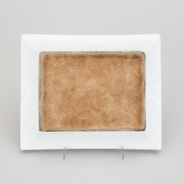 A Hermès porcelain ashtray.
