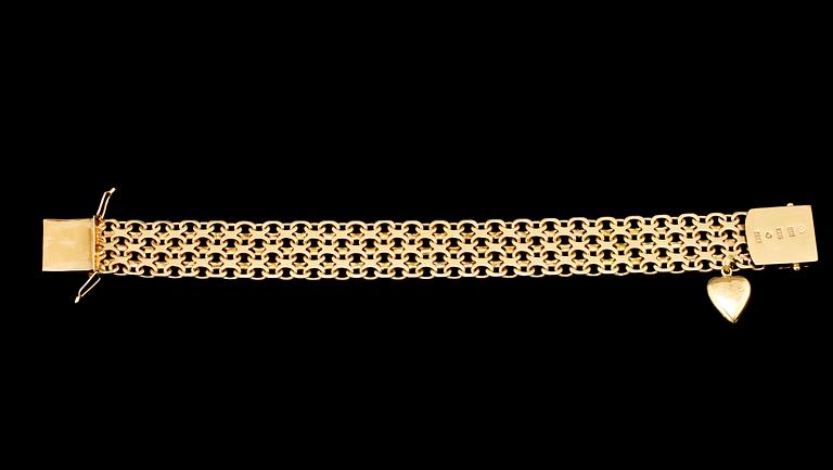ARMBAND, 18k guld, länk med en berlock, Stockholm, 1958. Vikt 40 g.