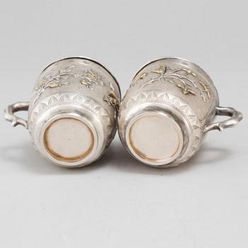 A pair of Chinese silver coffee cups with liners, early 20th Century.