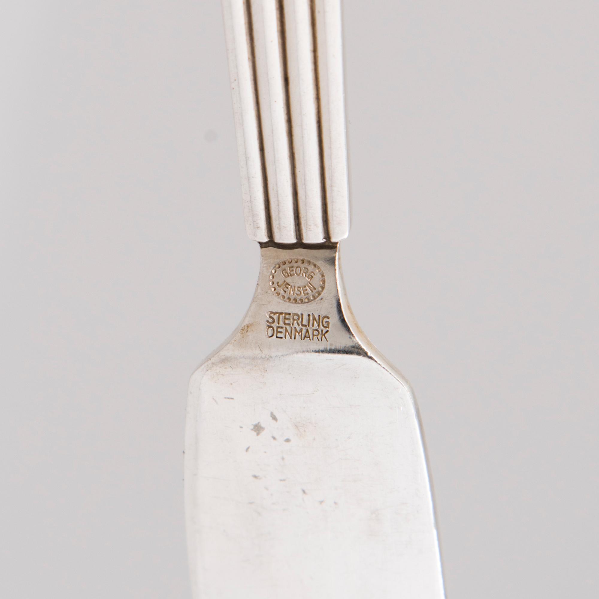 A 106 PIECE SILVER 'Bernadotte' cutlery set for George Jensen Denmark 1945-1977.