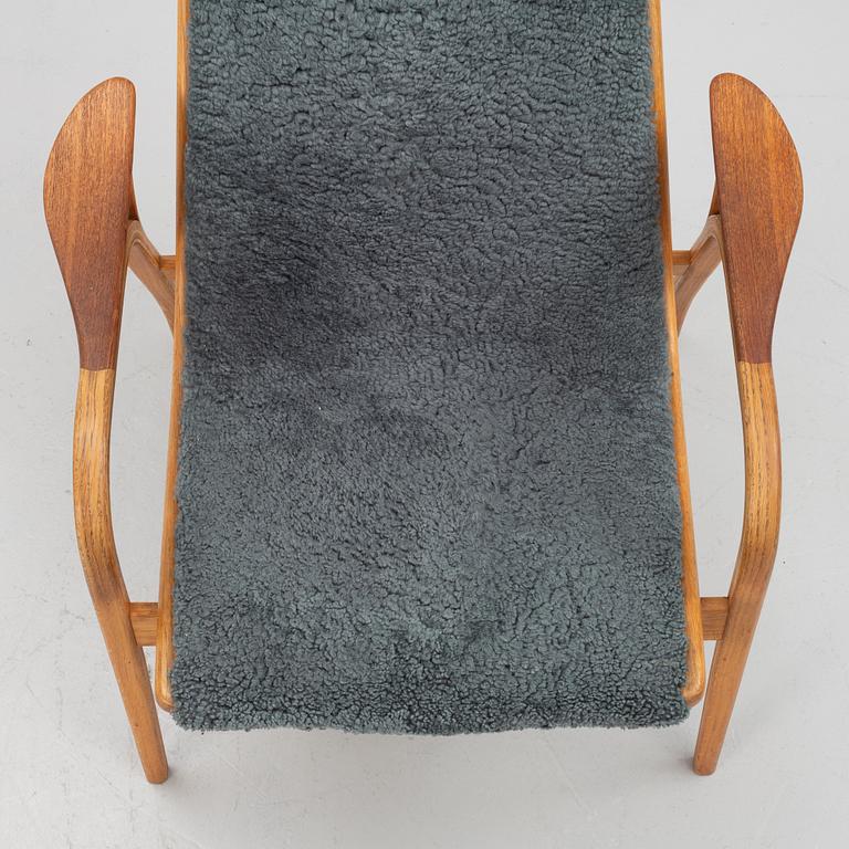 Yngve Ekström, a "Lamino" armchair with ottoman, Swedese, Sweden.