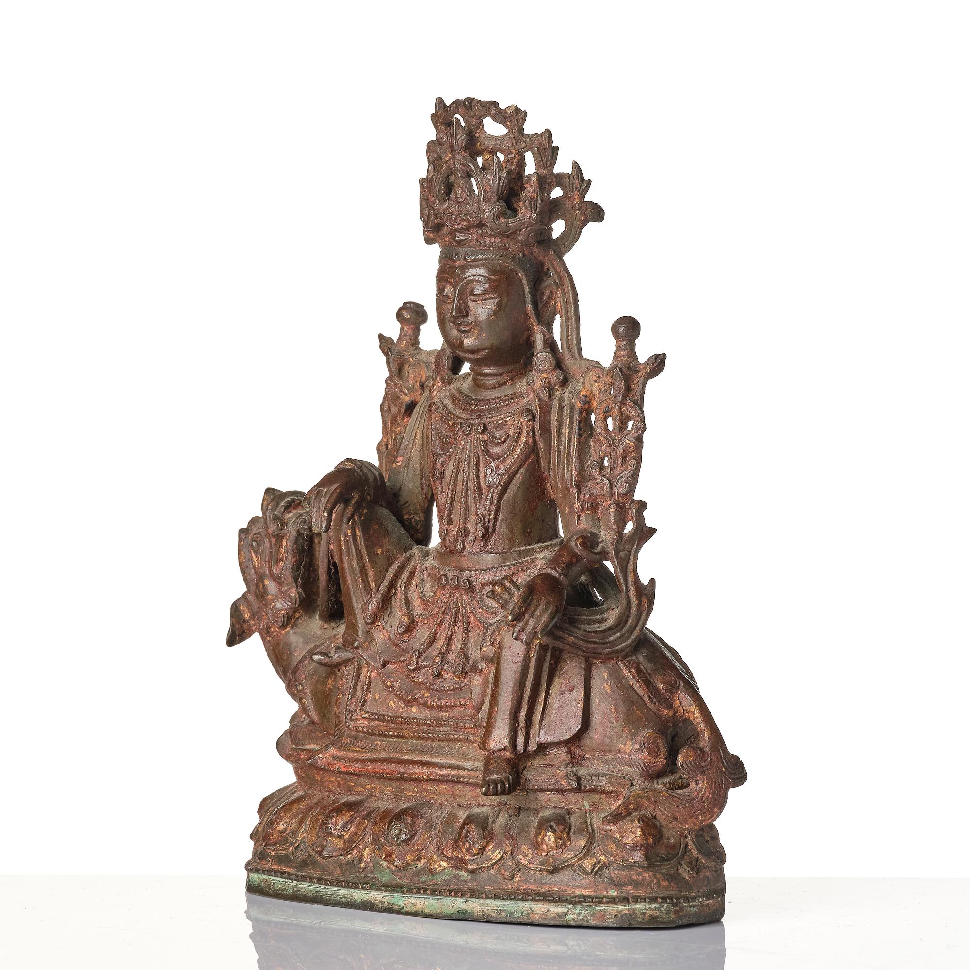 A Chinese bonrze figure of a Budha, probably late Ming dynasty 17th century.