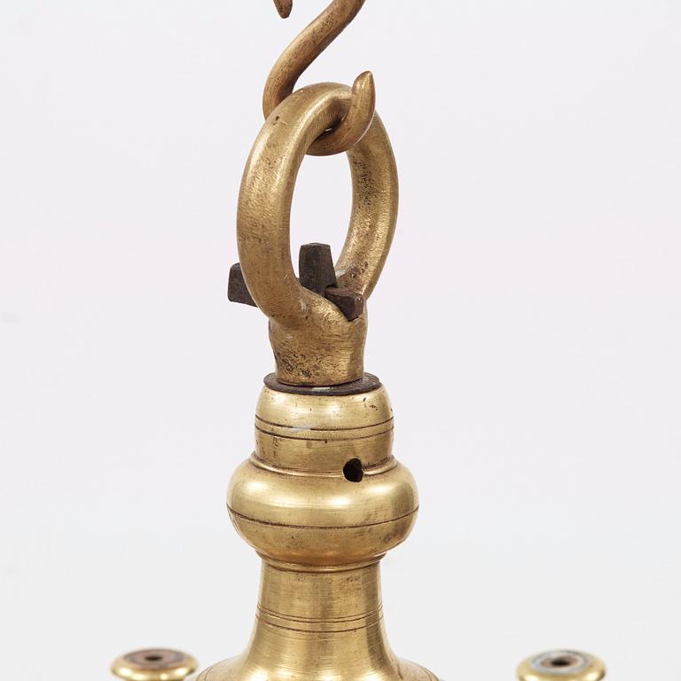 A 19th century eight-light brass chandelier in the manner of Hans Rogiers van Harelbeke.