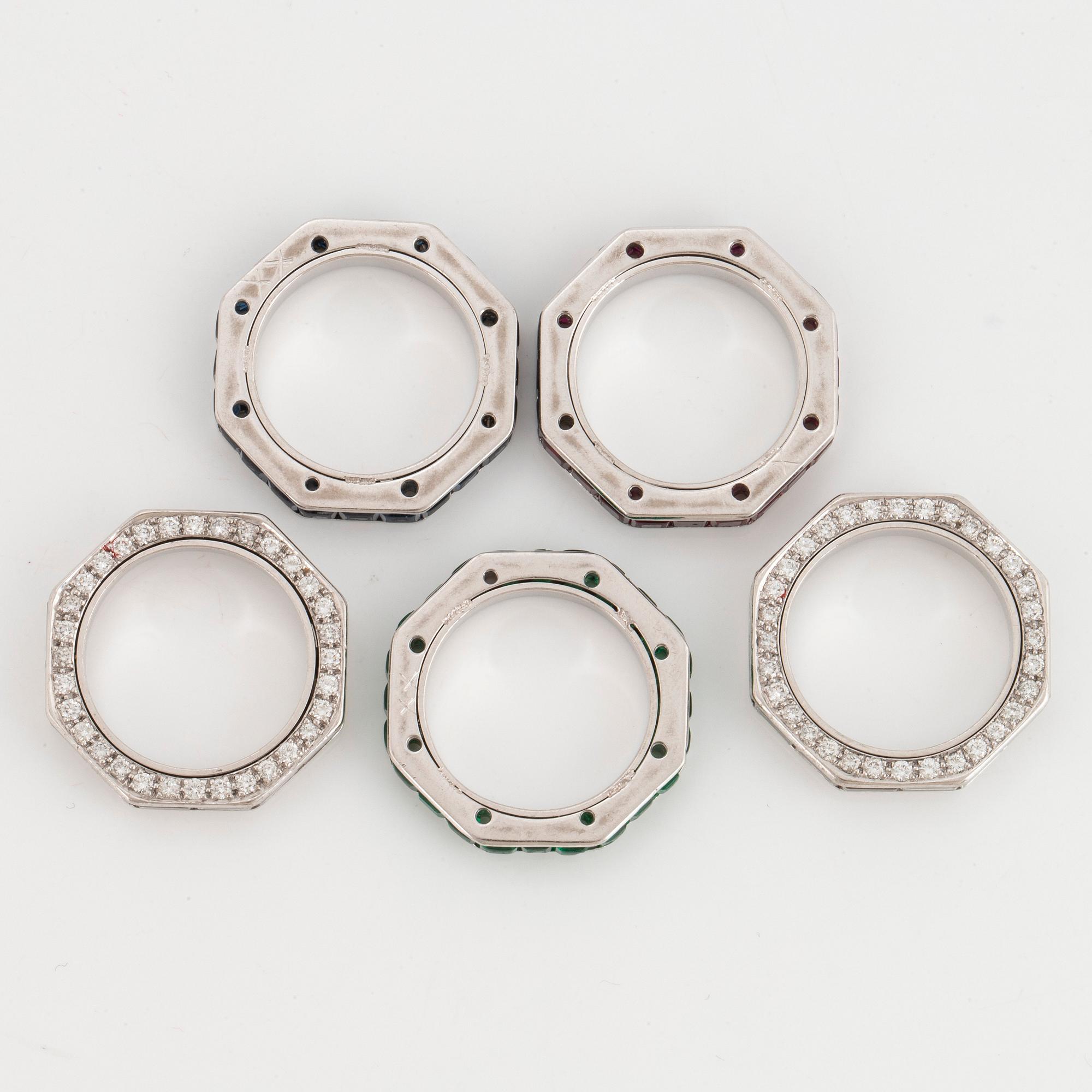 Five Paul Binder rings in 18K white gold set with baguette- and round brilliant-cut diamonds.