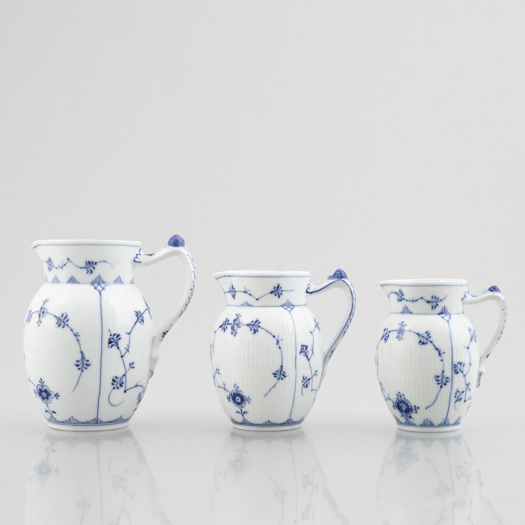 Three 'Blue Fluted' / 'Musselmalet' porcelain milkjugs, Royal Copenhagen, model 159, 450, 459, 1893-1900 and later.