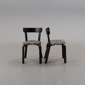 a dining table '81B' and four '69' chairs by Alvar Aalto, Artek.