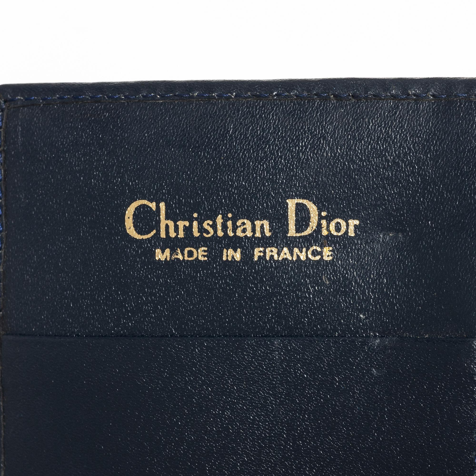 Christian Dior, a wallet.