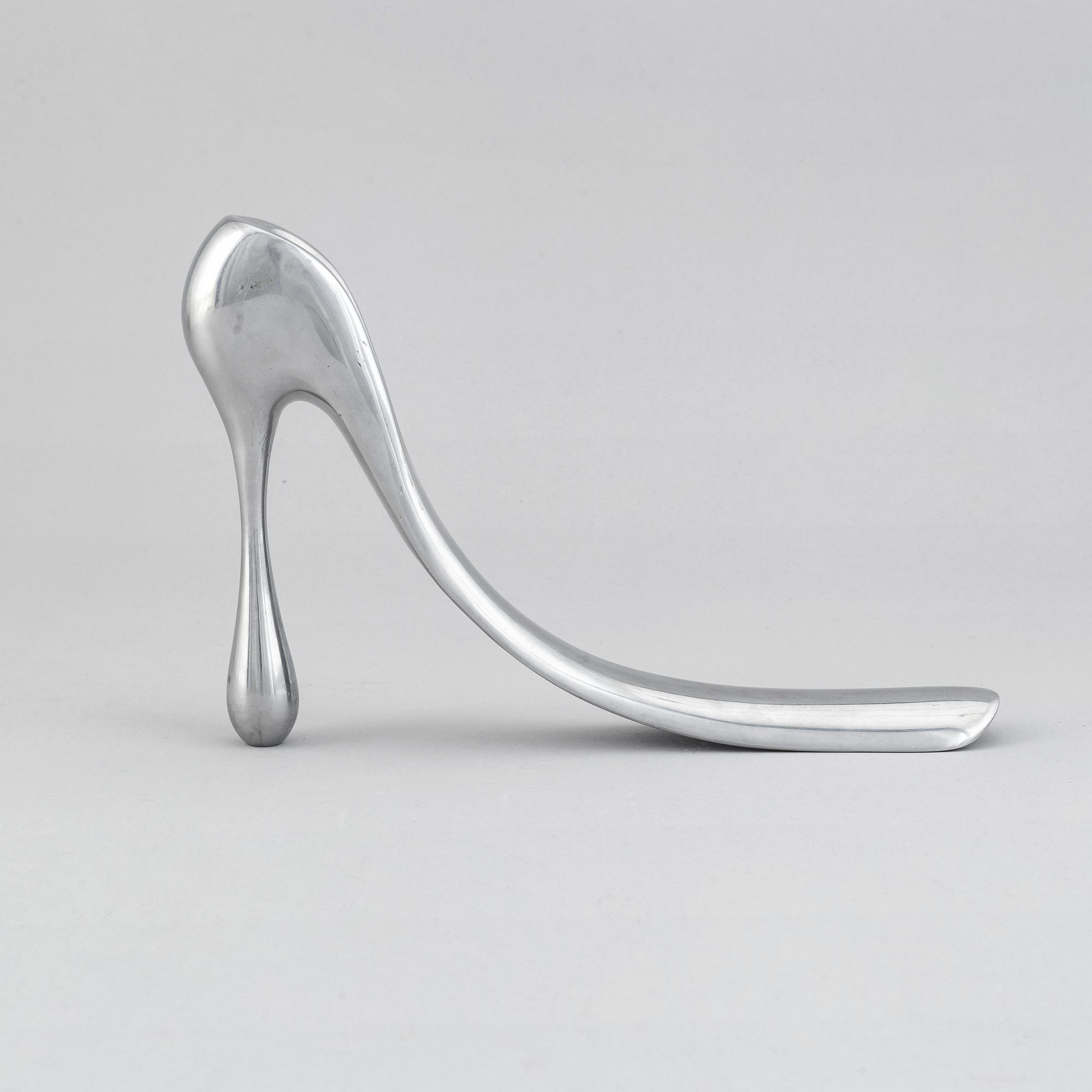A metal shoe horn by Manolo Blahnik, 2000s.