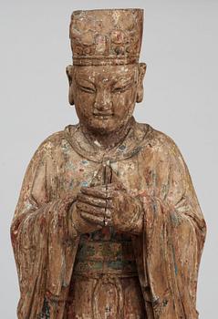 A wooden sculpture of a deity, Ming style.