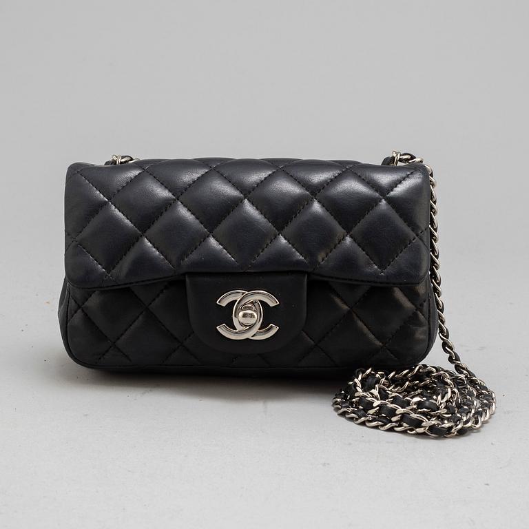 CHANEL, a black leather 'Extra mini flap bag' 2012-13.