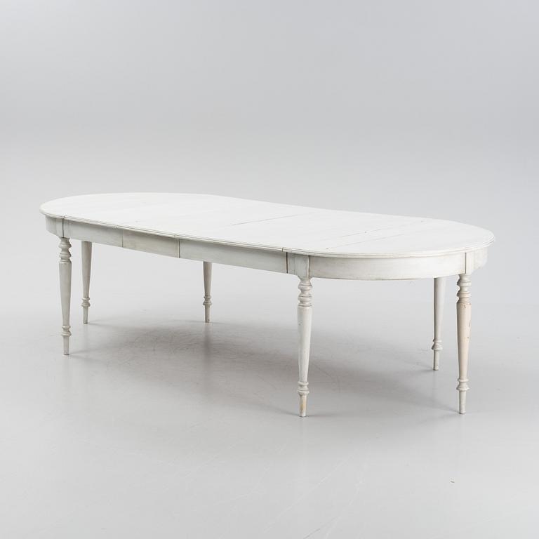 A painted dining table, 20th Century with older parts.