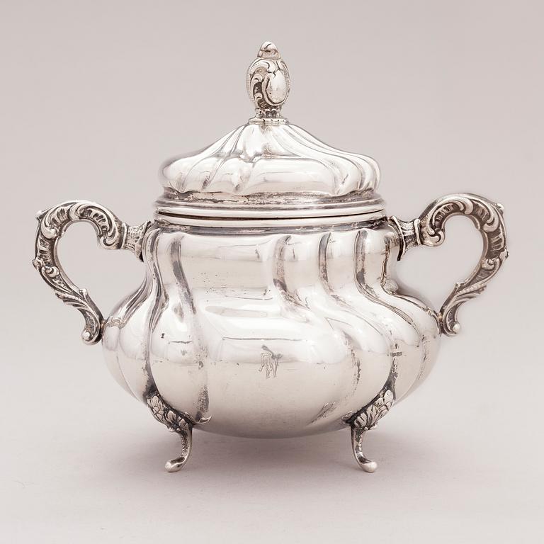 A lidded silver sugar bowl and a set of six silver bowls, Germany.