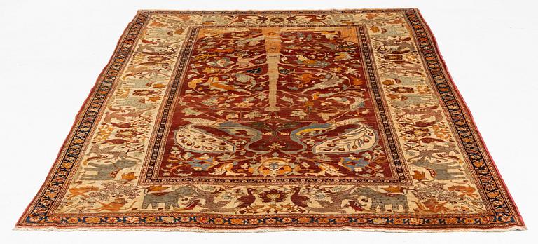 An antique silk Tabriz carpet, north west Persia, c 239 × 168 cm.