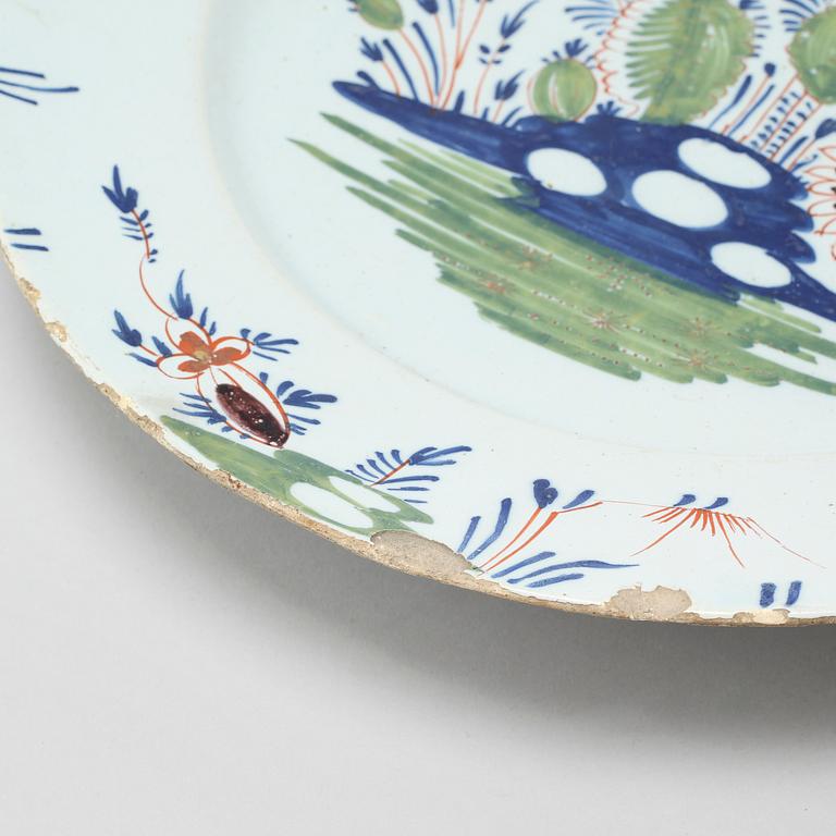 A faience dish, 18th century.