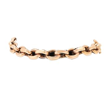An 18K gold anchor link bracelet.