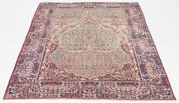 An antique Kirman rug, south Persia, c. 220 x 140 cm.