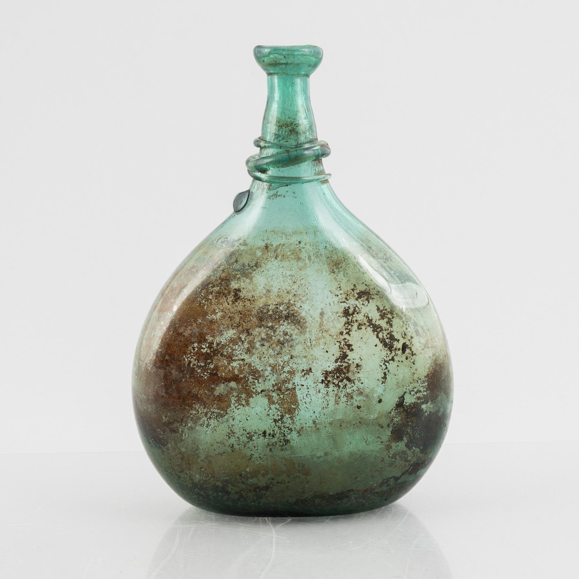 A turquoise tinted glass bottle, 19th century.