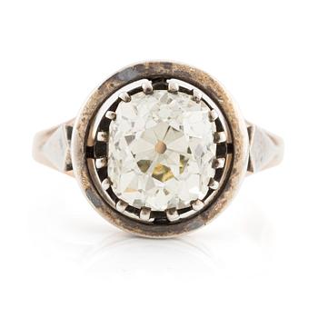 592. A 14K gold and silver ring with an old-cut diamond.