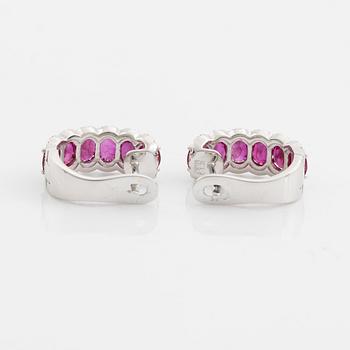 Earrings with rubies and brilliant-cut diamonds.