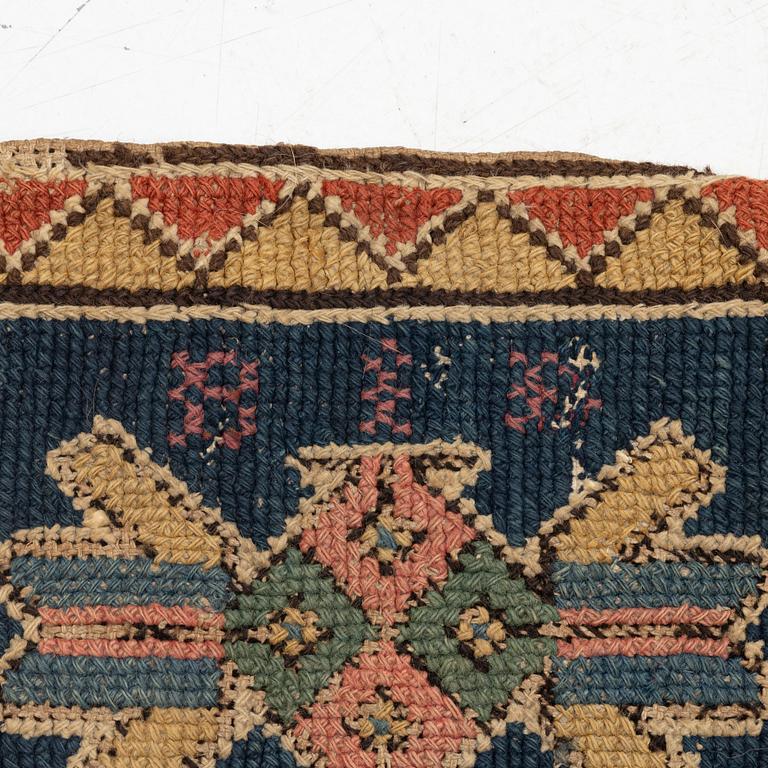 An embroidered carriage cushion, c. 93 x 45 cm, Torna or Bara district, Scania signed BID, circa 1790-1810.