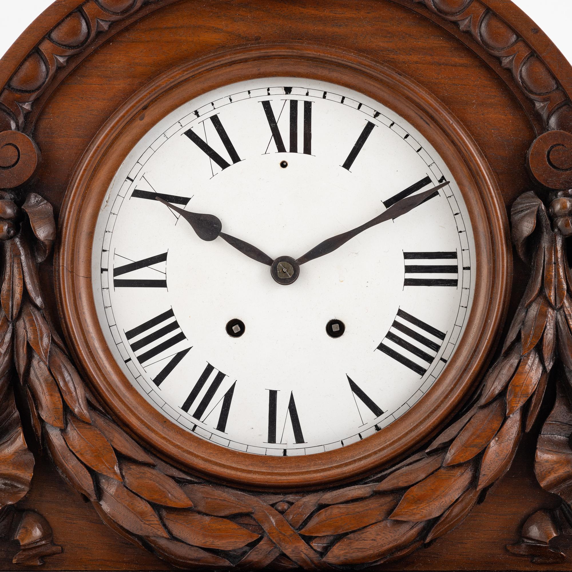 A mantel clock, early 20th Century.
