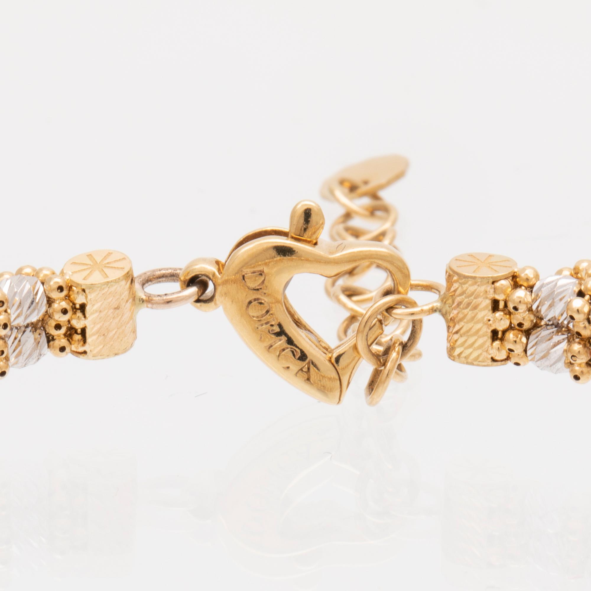 An 18K white and red gold necklace by D'orica Italy.