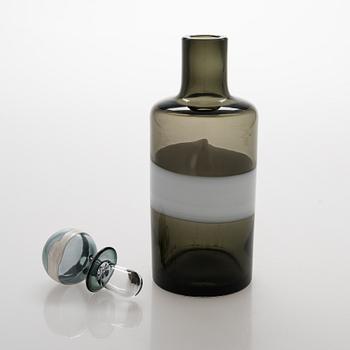 A glass carafe with 9 drinking glasses. The carafe signed Venini, Murano ITALIA.