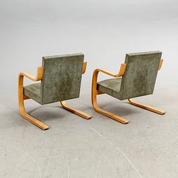 Alvar Aalto, a pair of birch armchairs model nr 402 21st century.