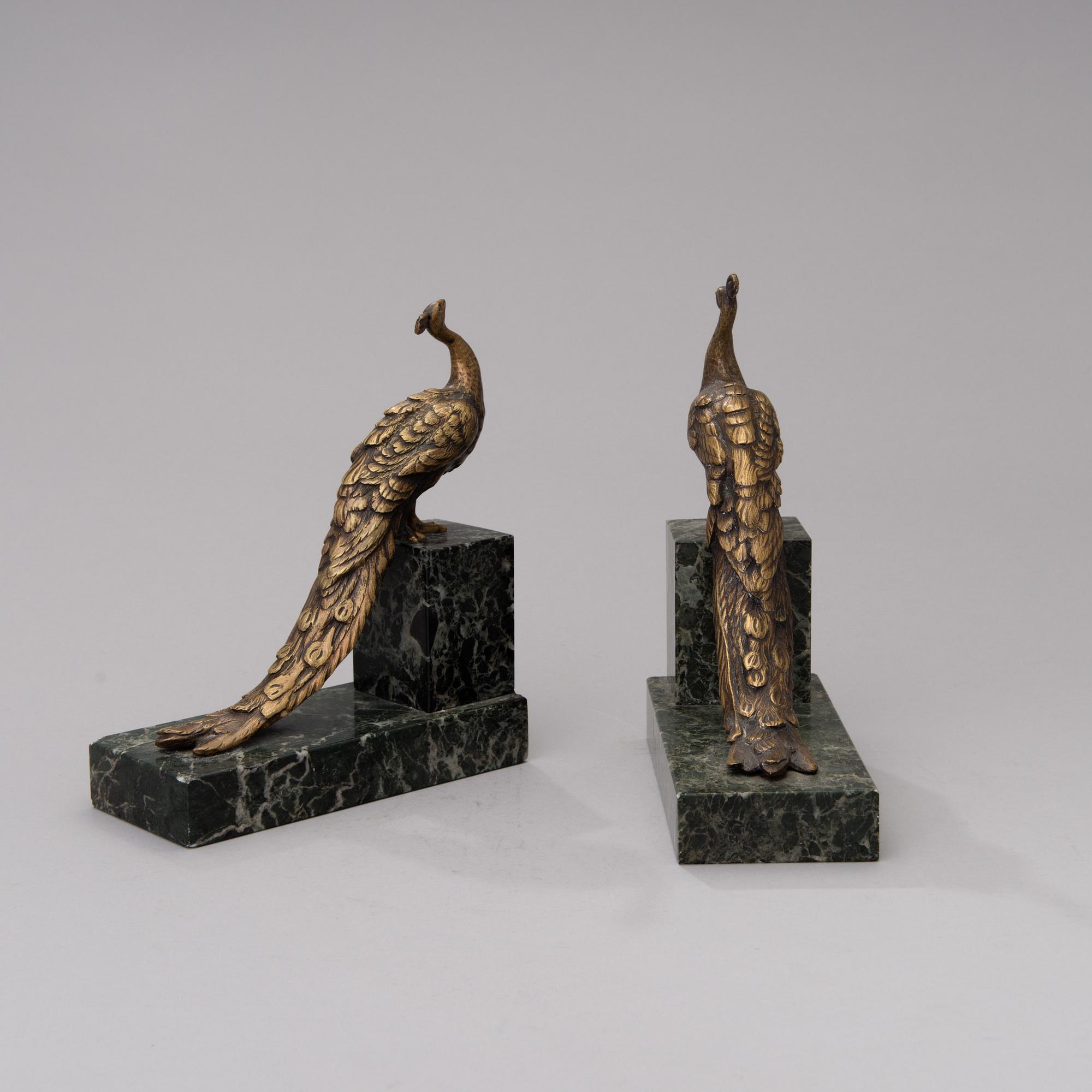 BOKSTÖD, 2 st, mässing och sten, 1900-talets första hälft.