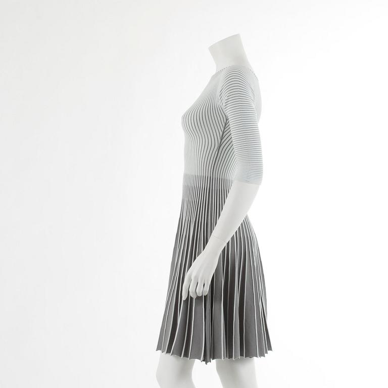 EMPORIO ARMANI, a pleated dress in grey and white, italian size 38.