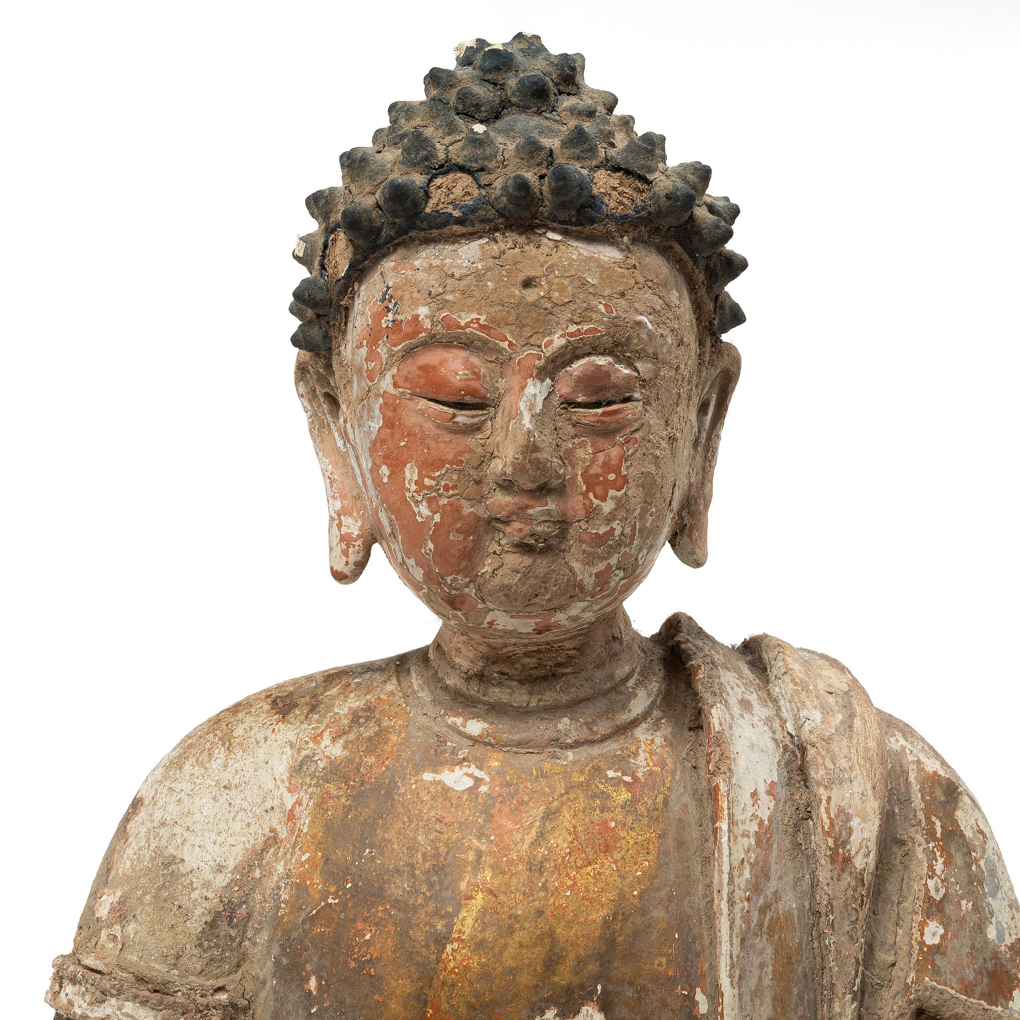 A Southeast Asian figure of a Buddha, 20th century.