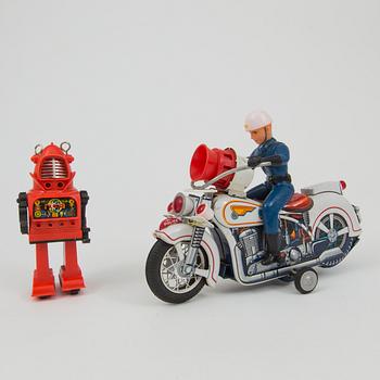 A Yoshiya robot and a Masudaya police motorcycle, Japan, 1960s.