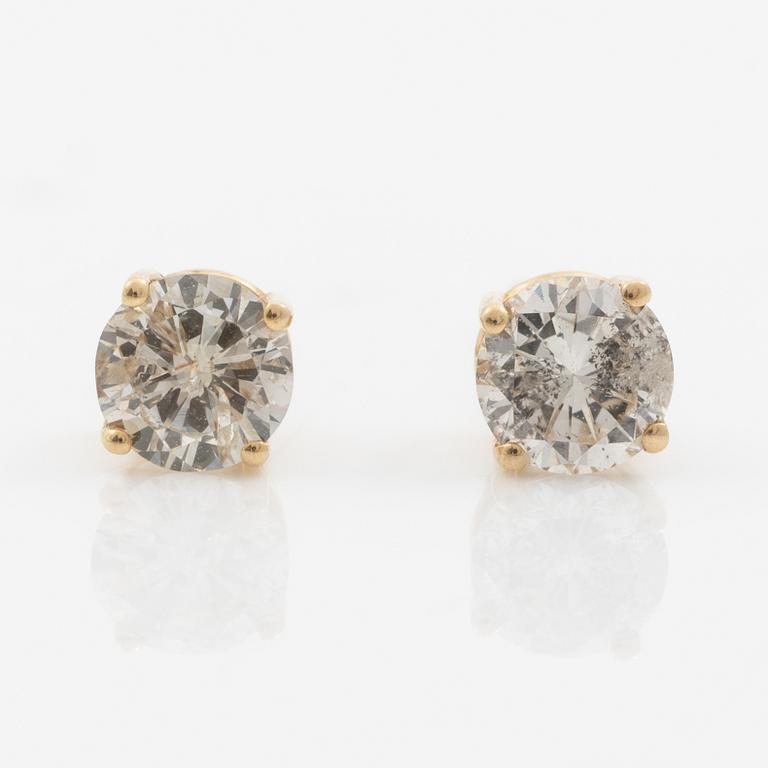 A pair of 14K gold earrings with round brilliant-cut diamonds.