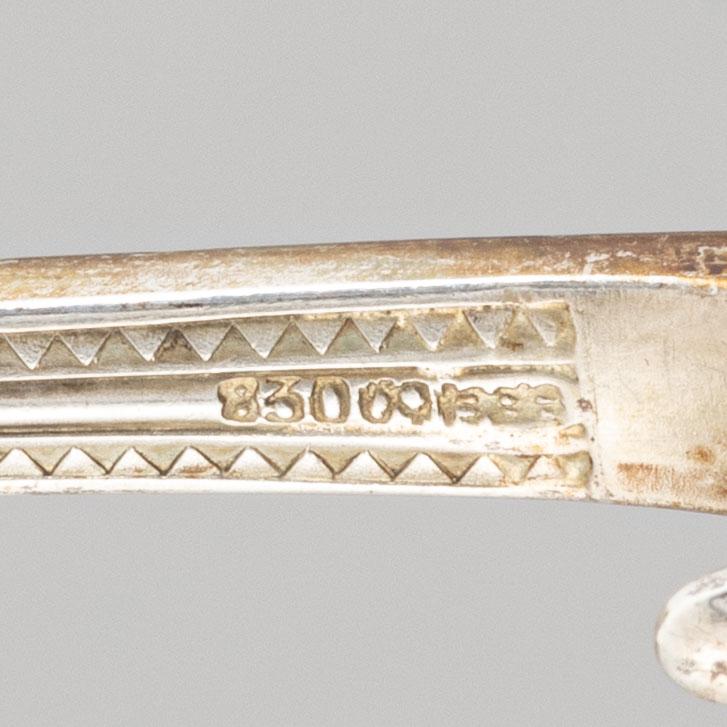 A pair of silver serving cutlery and a pair of sauce spoons, including Germany, early 20th century.