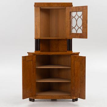 A Swedish Grace corner cabinet, 1920's/30's.