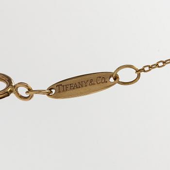 Tiffany & Co, Elsa Peretti, an 18K gold 'Alphabet Pendant' necklace.