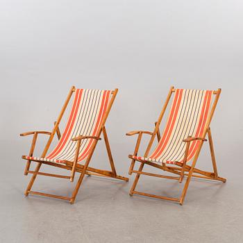 A pair of mid 20th century beach chairs.