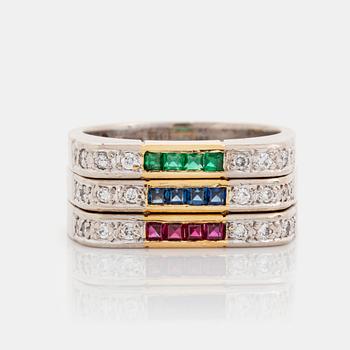 377. Gaudy rings in 18K gold set with step-cut rubies, emeralds and sapphires.