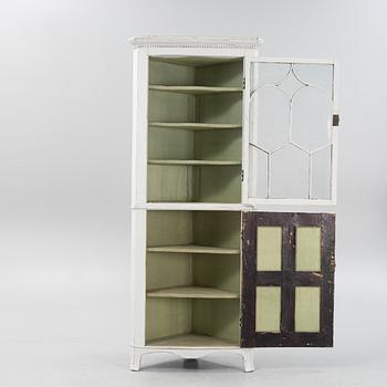 A gustavian style painted corner cabinet, 19th century.