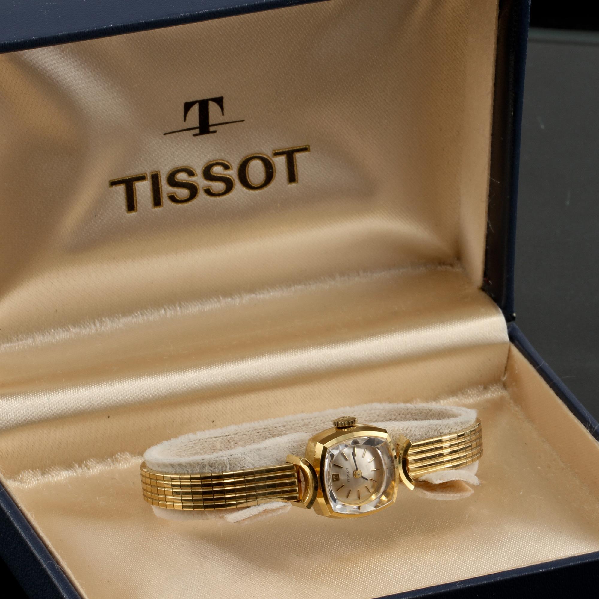 DAMARMBANDSUR, 18k guld, Tissot. Vikt 27 g.