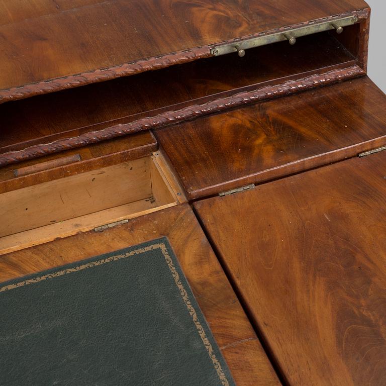 A mid 19th century writing desk and chair.