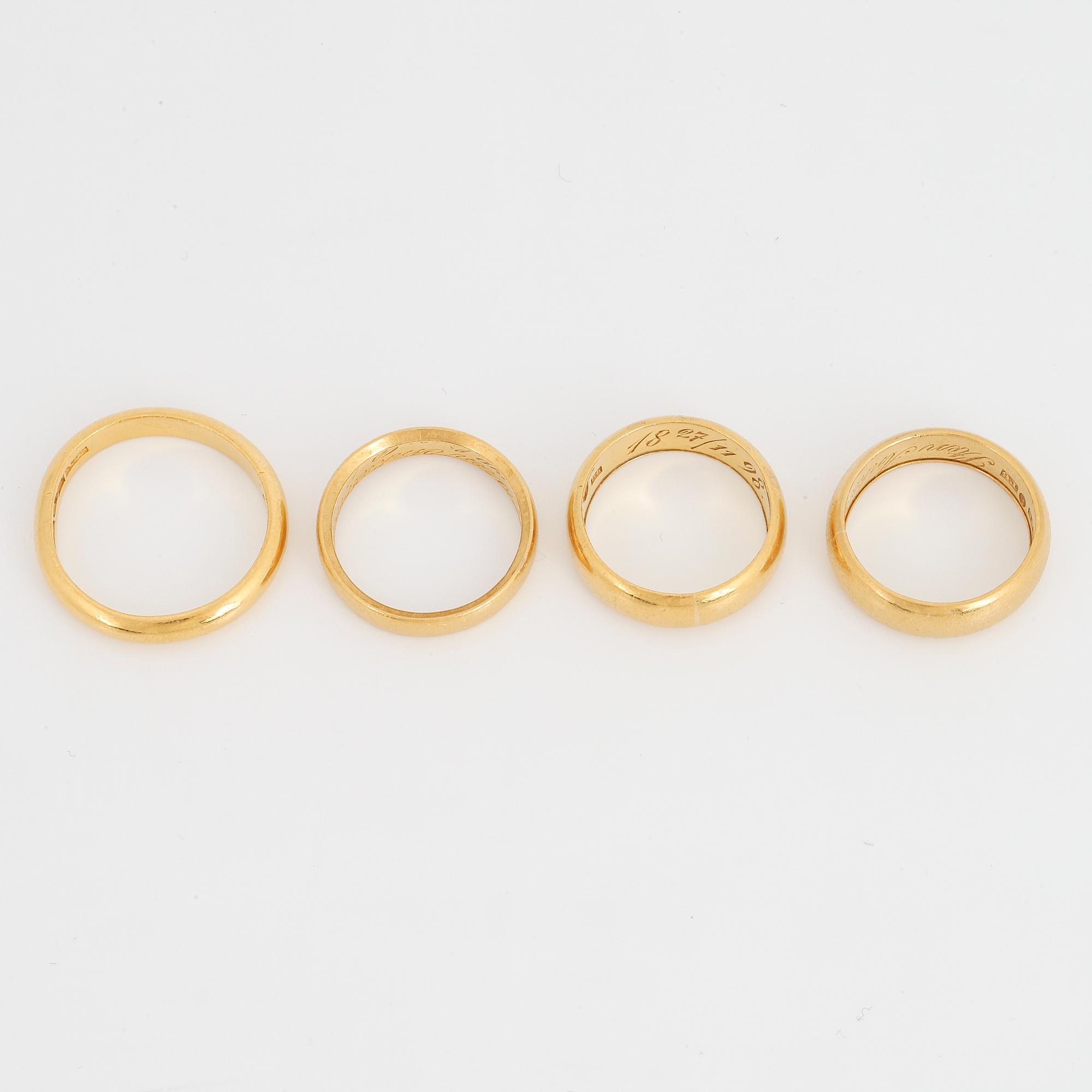 Four 23K gold rings.