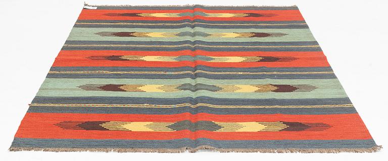 A persian kilim,  ca 242 x 181 cm.