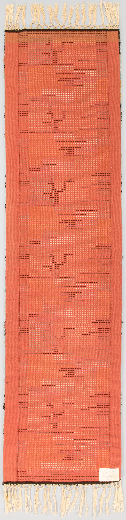 Tuntematon taiteilija, keinutuolimatto, 1930-luku. Noin 190x48 cm.