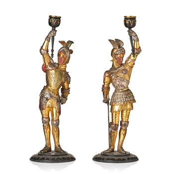 190. A pair of presumably German knights candlesticks, secound half 19th century.